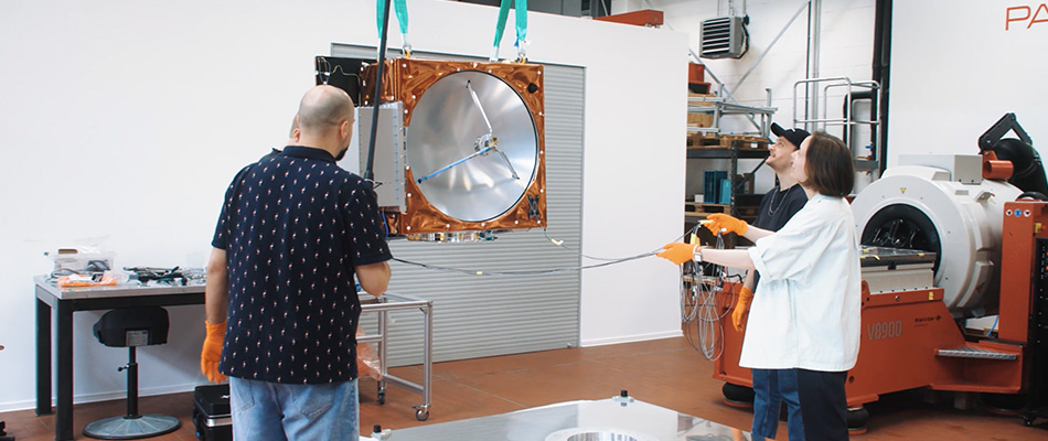 Members of Reflex Aerospace working in a lab space.