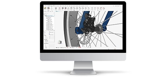 A computer monitor displaying the new HyperMesh user interface, featuring a bicycle wheel and frame in the modeling window for a CAE design.
